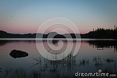 Sunset on a calm lake Stock Photo