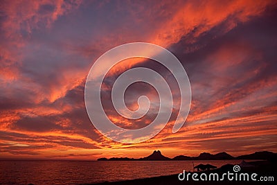 Sunset clouds at shore Stock Photo