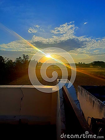 Sunset cloudy roof view farms Stock Photo