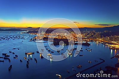 Sunset at container terminal in Hong Kong Stock Photo