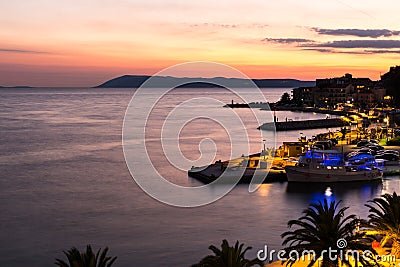 Sunset in croatian resort Podgora, last beams of sun Stock Photo