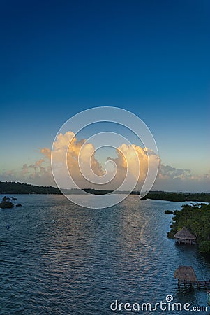 Sunset cumulus clouds on tropical horizon Stock Photo