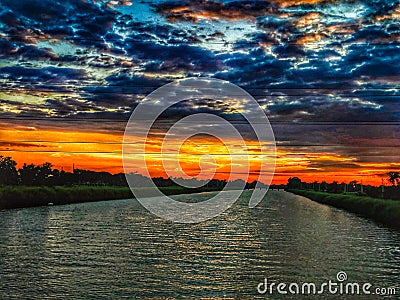 Sunset with deep clouds Stock Photo