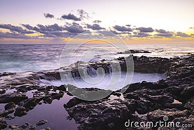 Sunset at El Bufadero natural blowhole on Gran Canaria. Ocean waves hiting rocks Stock Photo