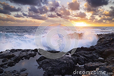 Sunset at El Bufadero natural blowhole on Gran Canaria. Ocean waves hiting rocks Stock Photo