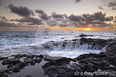 Sunset at El Bufadero natural blowhole on Gran Canaria. Ocean waves hiting rocks Stock Photo