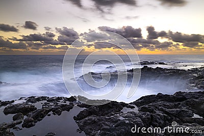 Sunset at El Bufadero natural blowhole on Gran Canaria. Ocean waves hiting rocks Stock Photo