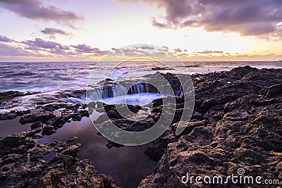 Sunset at El Bufadero natural blowhole on Gran Canaria. Ocean waves hiting rocks Stock Photo