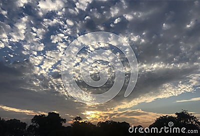 Sunset with feathery clouds Stock Photo