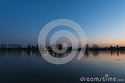Sunset and Ferry on river Nederrijn Stock Photo