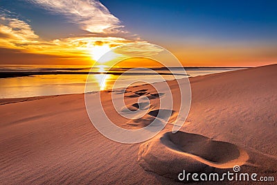 Dune du Pilat, France - Into the Sunset - Footsteps in the sand of the Dune du Pilat Stock Photo