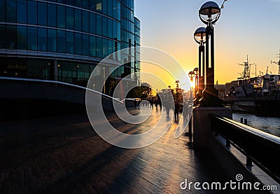 Sunset forms Silhouette of Thames sidewalk Editorial Stock Photo