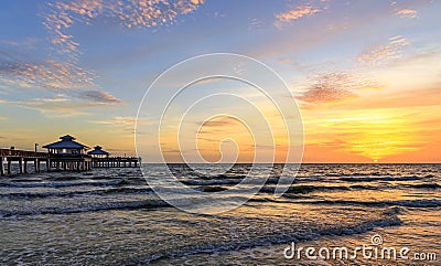 Sunset in Fort Myers Beach with a fishing pier Stock Photo