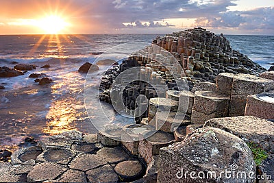 Sunset at Giant s causeway Stock Photo