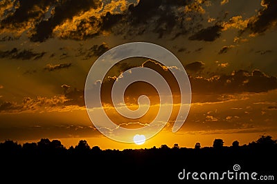 Landscape silhouette with sunset and godrays Stock Photo
