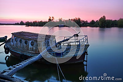 Danube River. Colored sunset landscape in natural reserve of the Danube Delta - landmark attraction in Romania Stock Photo