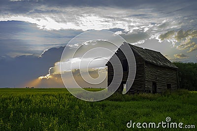 Abandoned old farm house in the prairies sunset Stock Photo