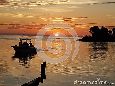 Sunset gulf beach boat island clouds Stock Photo