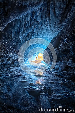 Sunset in the ice cave. Winter landscape. Lake Baikal. Stock Photo