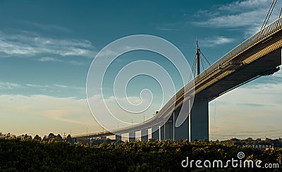 Melbournes Westgate Bridge against a dynamic blue sky and the vibrancy of colors from a low sun. Stock Photo