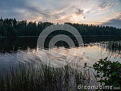 Sunset on the lake. beautiful colors. chaotic clouds Stock Photo