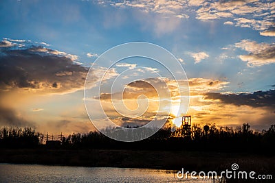 sunset at the lake with a beautiful sky and coal mining mines, czech karvina OKD Stock Photo