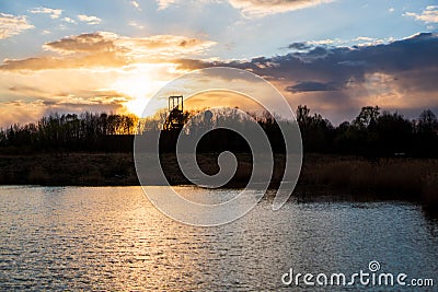 sunset at the lake with a beautiful sky and coal mining mines, czech karvina OKD Stock Photo