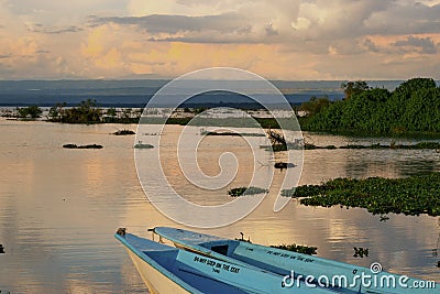 Fishing boats against a golden sunset at Lake Naivasha, Rift Valley, Kenya Stock Photo