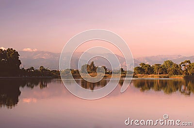 Sunset at the lake. Pink sky. Warm summer Stock Photo