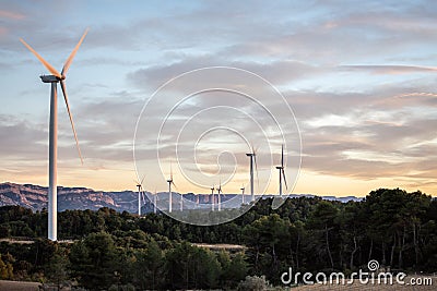 Sunset of landscape with windmills Stock Photo