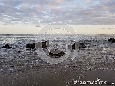 Water colliding with immovable rocks Stock Photo