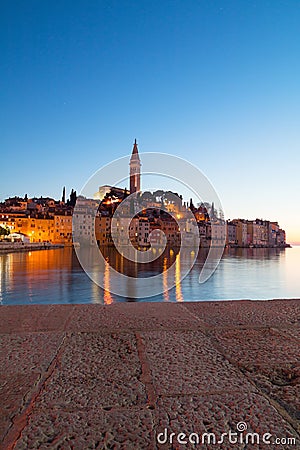 Sunset at medieval town of Rovinj, colorful with houses and church Stock Photo