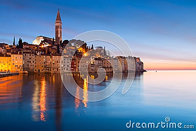 Sunset at medieval town of Rovinj, colorful with houses and church Stock Photo