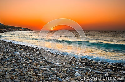 Sunset at Mediterranean Beach Stock Photo