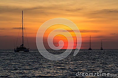 Sunset on the Nai Harn beach in Phuket island Stock Photo