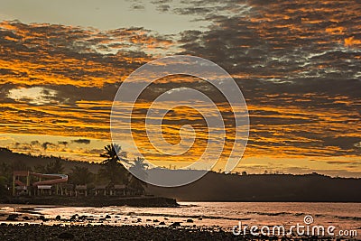 Sunset on the ocean with colored clouds Stock Photo