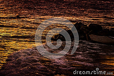 Sunset Ocean With Waves and Rocks Stock Photo