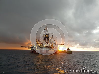 Sunset at oilrig Editorial Stock Photo