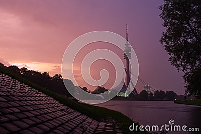 Sunset in the Olympiapark in Munich with view on the lake and tower Editorial Stock Photo