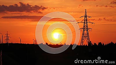 Sunset, orange sky and electrical lines Stock Photo