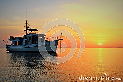 Sunset on Our Kadey Krogen 42 anchored at Annie Bight, Eleuthera Bahamas Stock Photo