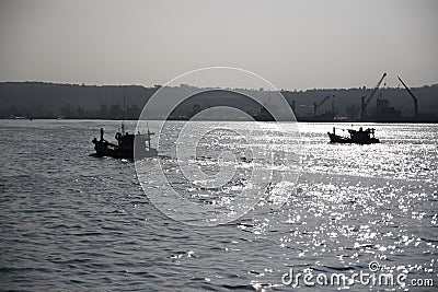 Sunset over asian port Stock Photo