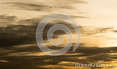 Sunset over Bangkok - Golden sky with plane Stock Photo