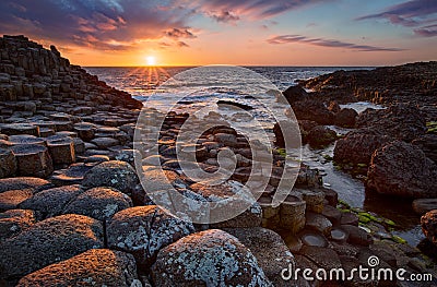 Sunset over basalt columns Giant`s Causeway, County Antrim, Northern Ireland Stock Photo