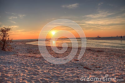 Sunset over the beach as a waterway of Clam Pass Stock Photo