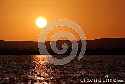 Sunset over the Birket Siwa salt-water lake, in the Siwa oasis, Egypt Stock Photo