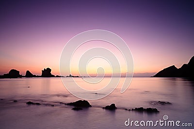 Sunset over Cantabric Sea in Silent Beach Stock Photo