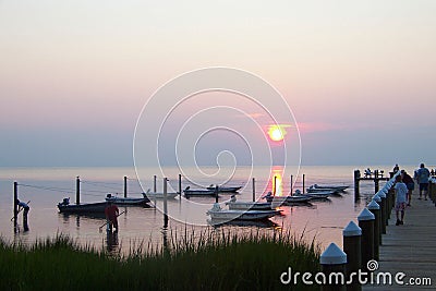 Sunset over a Chesapeake Bay dock with boats Stock Photo