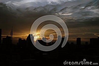 Sunset over the city with clouds sky Stock Photo