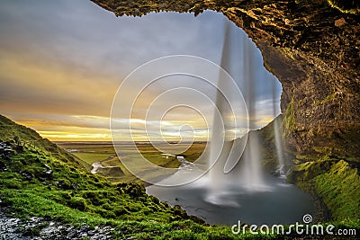 Sunset over the famous Seljalandsfoss Waterfall in Iceland Stock Photo